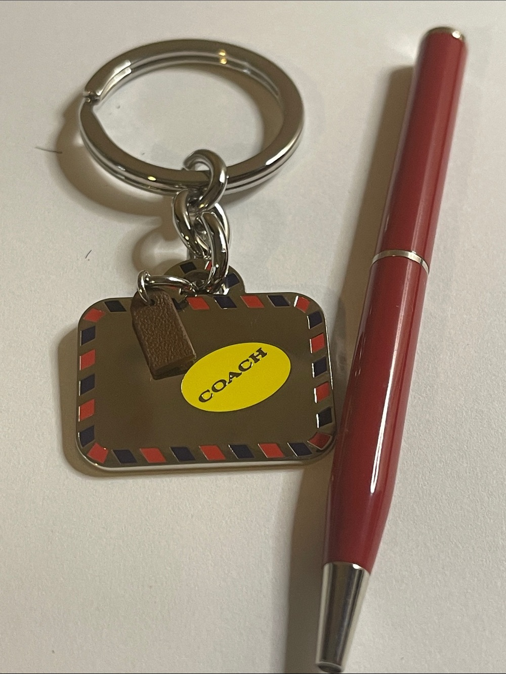 COACH Silver Bag Keychain and Coach Pen